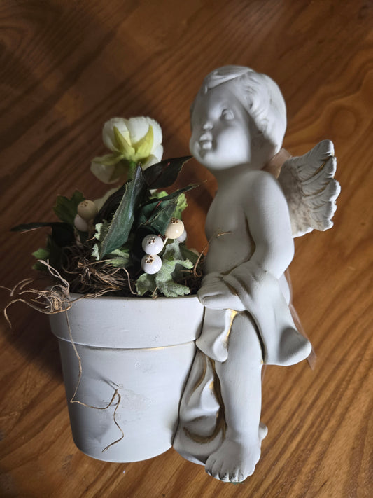 Angel boy holding flowers